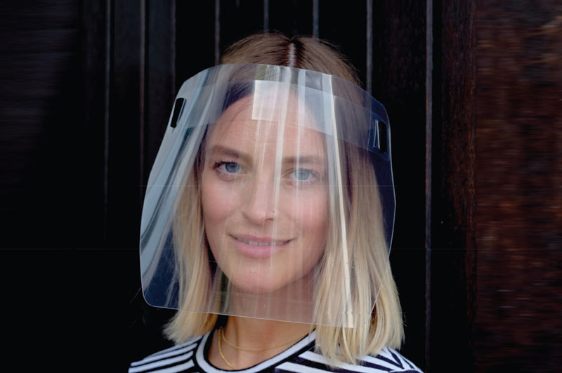 Front view of a model wearing PET Protective Face Shield with Elastic Band in black